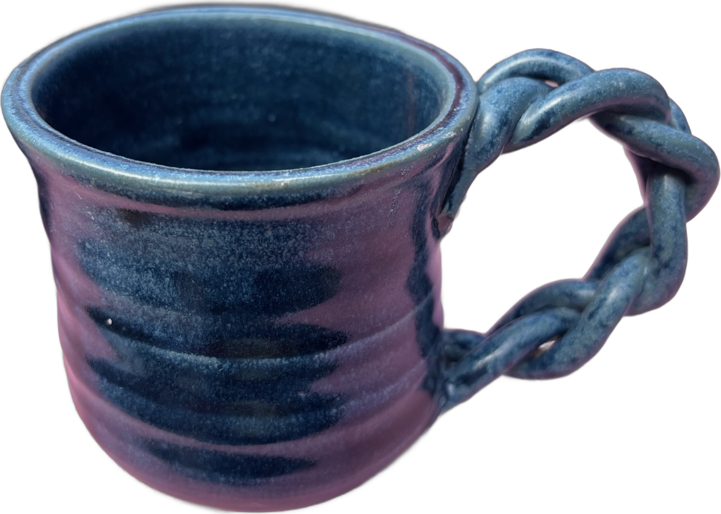 A deep blue mug with a braided clay handle
